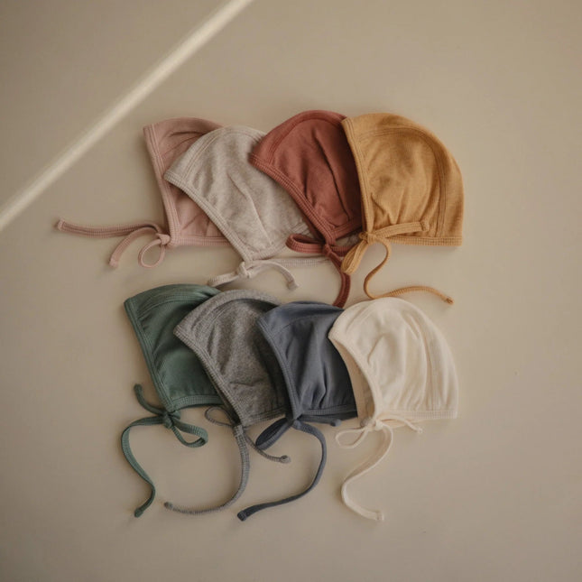 Mushie Babymutsje Bonnet Beige Melange koop je bij Babywinkel