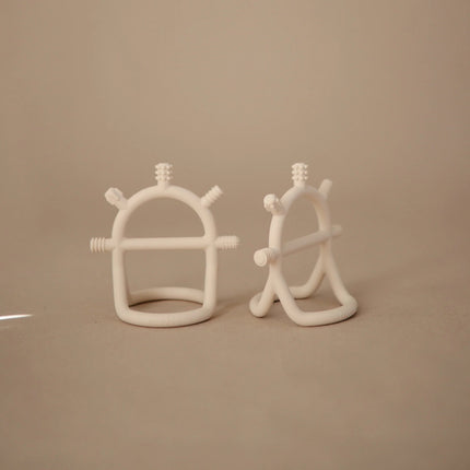 Mushie Bijtring Sensory/Shifting Sand koop je bij Babywinkel