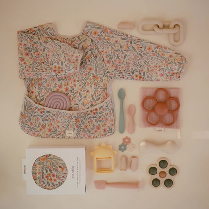 Mushie Slabbetje Lange Mouwen Pastel Blooms koop je bij Babywinkel